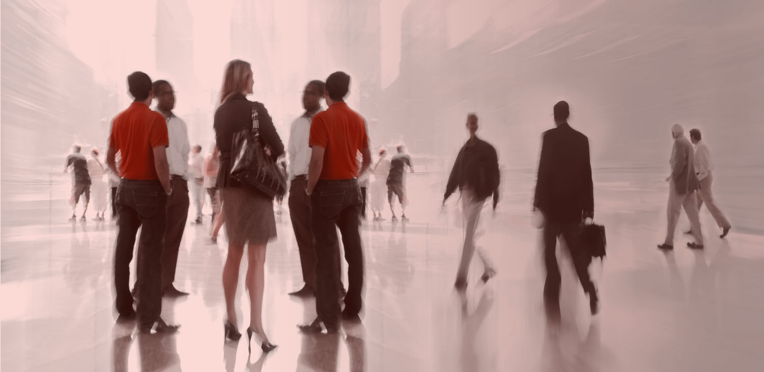 Professionals moving through a bright modern public space
